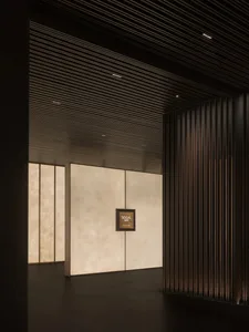 A dimly lit hallway with wooden walls and paneling, creating a sense of elegance and timelessness