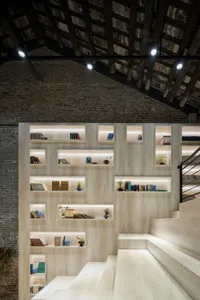 Cozy study with a wooden bookshelf, dim lighting, and a traditional atmosphere