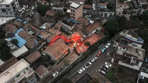 A city street lined with brick buildings and cars, capturing the essence of urban life with a blend of architecture and transportation