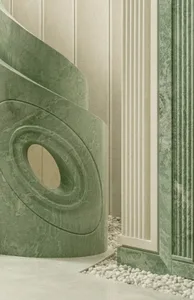 Modern building with a large circular sculpture and green marble-like walls, set in a soft and diffused light