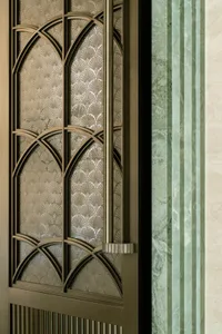 A doorway with a glass window and metal frame, set against a green and white background, adorned with decorative design elements