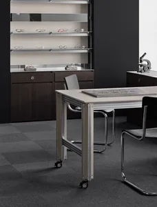 2D floor plan of a modern workspace with a desk, chair, sink, and dining table, featuring eyeglasses on a shelf and a focus on functionality and organization