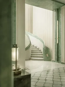 A dimly lit hallway featuring a white staircase with a green and white design, made of marble, and serving as a focal point in the space