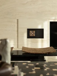 A classic modern dining room with a white marble wall, a wooden table, and a vase, set against a black frame, creating a sophisticated atmosphere