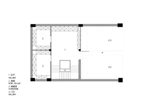 Black and white floor plan of a large open space with divided sections, numbers, and labels