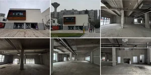 A modern building with a mix of concrete and glass elements, featuring a combination of open and enclosed areas with a focus on interior design