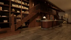 A well-lit room with wooden floors and walls, featuring a staircase, counter, and bookshelf, creating a warm and inviting atmosphere