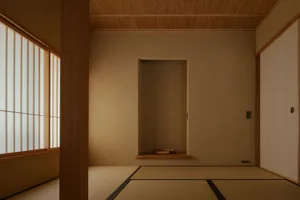 Cozy room with a wooden door and floor, natural light from the open door, and a warm atmosphere