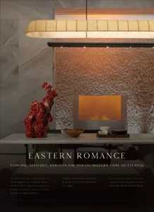 Cozy living room with a fireplace, dining table, and vase with flowers, surrounded by a couch, chair, and bowl on the table