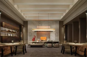 Cozy living space with a modern design, a large fireplace, and natural light from windows, featuring marble and wood materials