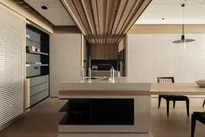 Modern open-plan kitchen featuring a large concrete island with integrated sink, oak slatted ceiling, built-in shelving unit, and adjacent dining table with black chairs.