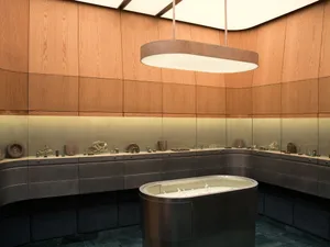 Modern jewelry boutique interior featuring curved walnut wood paneling, backlit glass display cases, and a central oval island vitrine under a large oval pendant light.
