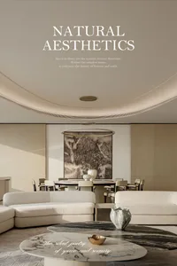 Modern minimalist living and dining room featuring two curved white sofas, a round marble coffee table, a large Chinese ink-wash mountain painting, and a dramatic circular pendant light under a curved ceiling.