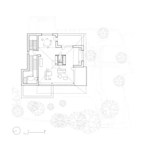 Black and white architectural floor plan of a two-storey residential house showing living areas, dining, kitchen, multiple bedrooms, staircases, and surrounding garden layout with trees.
