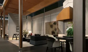 Modern hotel lobby lounge featuring dark wood furniture, a round black dining table with cream chairs, a black sofa, wooden ceiling panels, and a traditional Chinese pine tree folding screen.