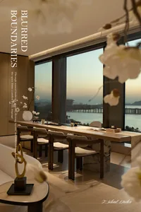 Modern dining area featuring a long walnut table with upholstered chairs, marble base, set against floor-to-ceiling windows overlooking a harbor and mountains at dusk.