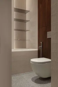 Modern minimalist bathroom corner with white wall-hung toilet, fluted beige wall tiles, floating glass shelves, dark walnut wood panel, and grey terrazzo floor.