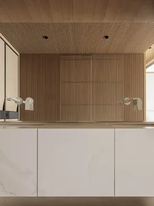 Modern minimalist bathroom vanity with white marble countertop and cabinetry, set against a vertical wood slat accent wall and matching slatted ceiling with recessed lighting.