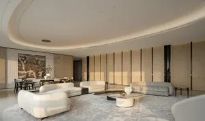 Modern luxury living room featuring curved white boucle sofas, a textured grey sofa, marble and dark coffee tables on a geometric rug, with a large mountain ink painting in the background dining area.
