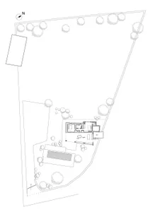 Black and white architectural site plan showing a modern residential building layout, surrounding trees, a rectangular pool, and a north orientation indicator.