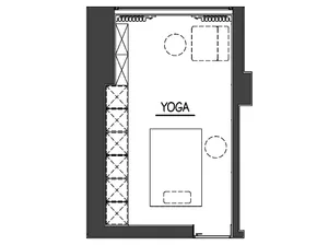 Black and white architectural floor plan of a yoga studio showing storage wall, yoga mat area, and circulation paths.