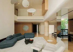 Modern double-height living room featuring a large blue bouclé modular sofa, white boucle armchair, sculptural black coffee table, circular art pieces, and warm wood paneling under a dramatic multi-ring chandelier.
