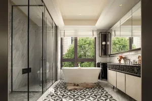 Modern luxury bathroom interior with white freestanding bathtub, marble walls, black and white geometric patterned floor tiles, and large windows overlooking green trees.