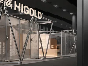 Modern stainless steel and mesh exhibition booth for Higold featuring angular structural frames and integrated lighting at a trade show.