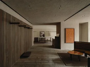 Modern minimalist entryway hallway with vertical wood paneling on the left, textured plaster walls, stone tile floor, built-in wooden bench, and a mustard-yellow upholstered banquette on the right.