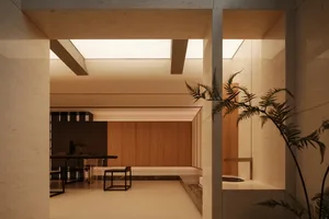 Modern minimalist interior featuring concrete walls, warm wood cabinetry, black metal furniture, and dramatic skylights creating soft natural illumination.