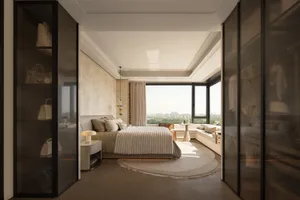 Modern luxury bedroom featuring a large bed with cream ribbed bedding, textured beige plaster accent wall, built-in floor-to-ceiling glass wardrobes, curved white sofa by the window, and a stunning city view through full-height windows.