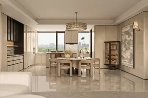 Modern luxury dining room with round Calacatta marble table, beige upholstered chairs, crystal chandelier, and open kitchen in neutral tones