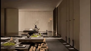 Modern Japanese zen living room featuring a large walnut wood platform, tatami-style sunken seating, vertical wood slat wall, and minimalist stone and moss arrangements.