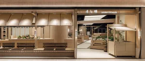 Modern Japanese-style indoor market with light wood counters, fabric awnings, wooden benches, and warm ambient lighting.
