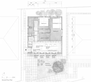 Black and white architectural ground floor plan of a Japanese modern house showing two bedrooms, walk-in closets, entrance hall with raised ceiling, skylight, chestnut column, and surrounding garden with weeping podocarpus.