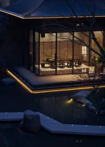 Night view of a modern Japanese tea room with large glass walls opening to a meticulously designed courtyard garden featuring stone paths, rocks, and uplighting.