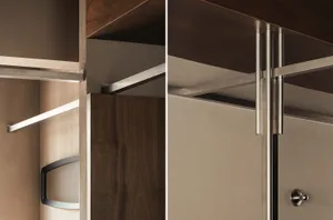 Close-up view of a modern walnut wood closet interior featuring adjustable shelving, a metal hanging rod with integrated LED strip lighting, and brushed nickel hardware.