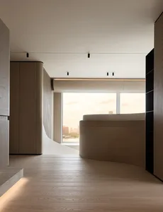 Modern minimalist bathroom featuring a curved oak bathtub positioned in front of a large window with a panoramic city view at sunset.