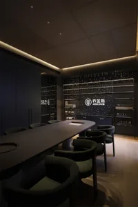 Modern dark wood conference room with curved green bouclé chairs, long wooden table, and illuminated starry product display wall for Jokins brand.