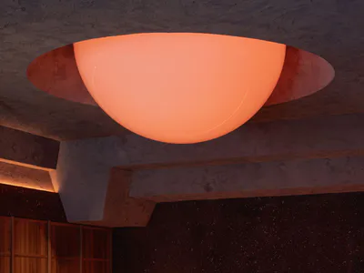 Modern cave-inspired bar lounge featuring a large glowing orange spherical pendant light, dark textured volcanic walls, a rough-hewn marble bar counter, wooden cabinetry, and warm ambient lighting.