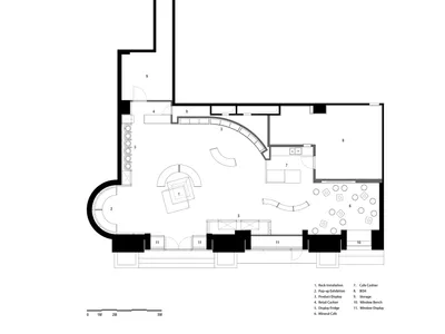Black and white architectural floor plan of a contemporary retail pop-up space with numbered zones and curved walls.
