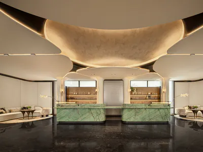 Modern luxury hotel lobby interior with two green marble reception desks, white curved sofas, dark polished floor, and a massive undulating beige ceiling feature with integrated lighting.