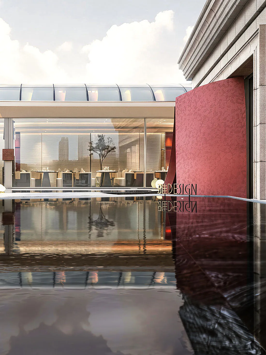 Modern luxury restaurant interior featuring a calm reflecting pool in the foreground, a large curved red textured wall on the right, glass-enclosed dining area with set tables, and a city view in the background under a glass canopy.