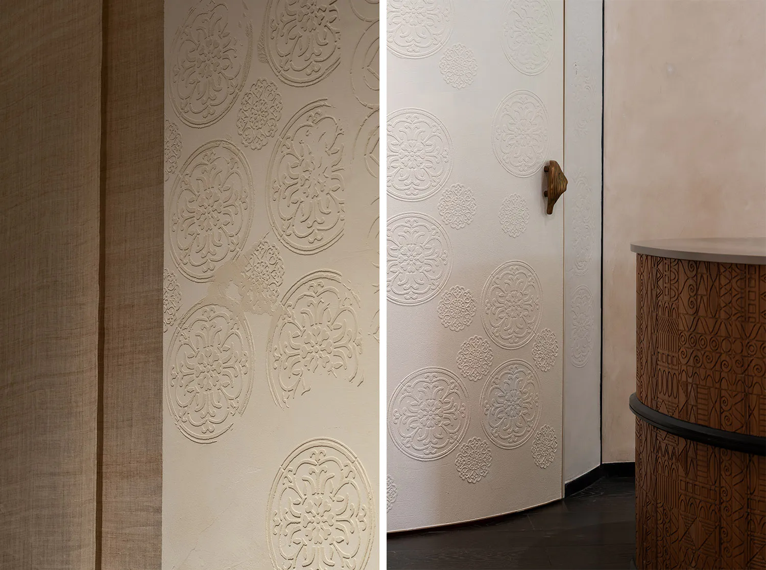 Split image showing a close-up of a beige textured wall with raised circular floral medallions next to a full view of a curved white door with matching embossed patterns, a wooden handle, and an adjacent carved wooden cylindrical cabinet.