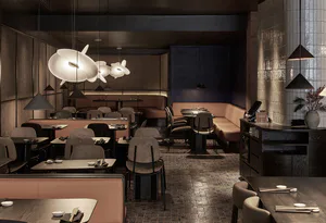 Modern Japanese restaurant interior with dark walnut tables, blush pink banquettes, sculptural white pendant lights, and textured walls.