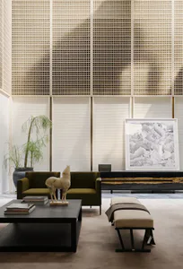 Modern minimalist living room featuring two olive green velvet armchairs, a dark wood coffee table with stacked books and a wooden horse sculpture, a beige bench with throw, a large potted weeping fig tree, and a black console with framed abstract ink wash painting against a backdrop of white grid screens and pleated blinds.