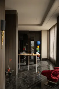 Modern luxury home office interior with dark wood paneling, polished black marble floor, sculptural wooden desk, red velvet lounge chair, and colorful stacked paper lanterns.