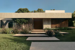 Modern minimalist house exterior with concrete facade, vertical wood slats, wooden front door, and landscaped garden with ornamental grasses and stepping stone pathway under a clear blue sky.