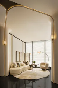 Modern luxury living room featuring a curved cream sofa, round area rug, sculptural coffee tables, and dramatic arched doorway with integrated lighting.