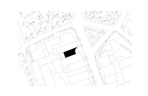 Black and white architectural site plan of a modern residential complex featuring multiple building blocks, pathways, and detailed tree symbols representing landscaping.